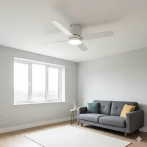 A sleek white hugger-style ceiling fan fitted to a low ceiling in a modern UK flat.