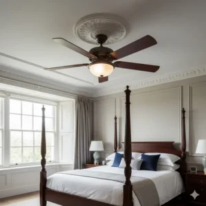A classic mahogany-effect traditional ceiling fan installed in a high-ceilinged British master bedroom.