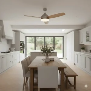 Stylish ceiling fan with integrated LED light positioned over a dining table in an open-plan British kitchen-diner.