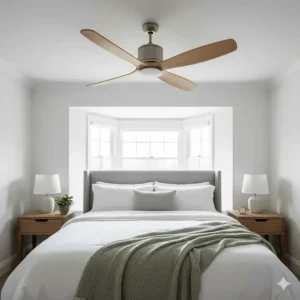 A whisper-quiet wooden blade ceiling fan positioned centrally in a minimalist British master bedroom to provide natural airflow and comfort.