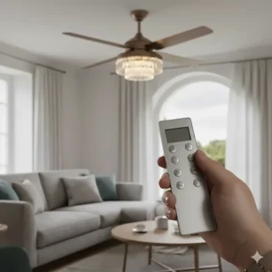 Close-up of a hand-held remote control operating a dimmable chandelier ceiling fan fitting.