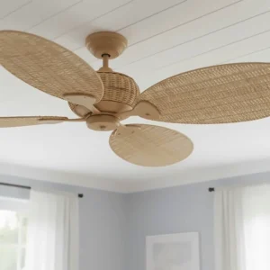 Close-up detail of hand-woven natural rattan blades on a coastal style ceiling fan.