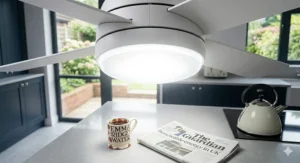 A minimalist white kitchen ceiling fan with a bright downlight, featuring a silent DC motor perfect for open-plan living.