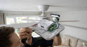 Close-up of a DIY installation for a ceiling fan remote receiver into a mounting bracket.