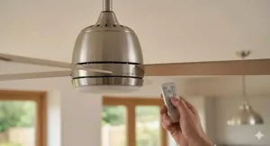 Close-up of a ergonomic handheld remote control for a quiet ceiling fan, showing clear button icons for speed and lighting control, with a thumb pressing 'Silent Mode' in a naturally lit UK lounge.