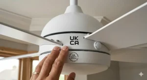 Close-up of the UKCA mark on a high-quality RF remote ceiling fan unit for UK safety standards.