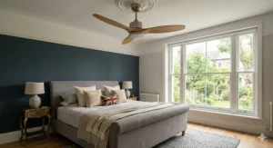 Natural wooden blade ceiling fan design adding warmth to a modern master bedroom.
