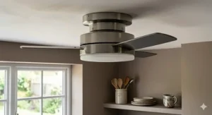 Brushed steel ceiling fan adding a contemporary finish to an open-plan kitchen.