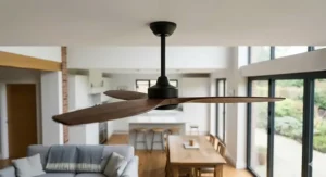A technical ceiling fan sizing diagram viewed from above the open plan space seen in image 0.png, detailing correct placement for a large-room fan with a 1.5m diameter.