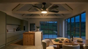 A sleek white ceiling fan integrated into a modern farmhouse kitchen with shaker-style cabinets.