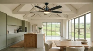 An elegant vintage-style brass ceiling fan complementing a period farmhouse kitchen interior.