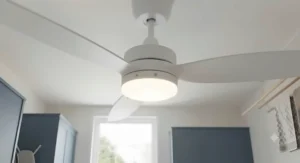 A contemporary British utility room interior featuring cabinetry and a ceiling fan.