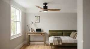 A wooden bedroom featuring a modern flush-mount ceiling fan above a bed with neutral linen sheets.