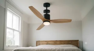 A low-profile ceiling fan with light installed close to a white ceiling in a clean, contemporary bedroom.