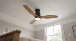 Elegant low-profile ceiling fan with wooden blades hanging over a desk in a bright, modern British home office.