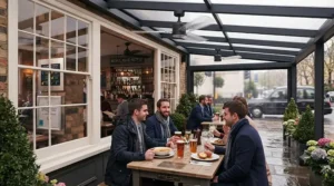 Weatherproof outdoor ceiling fans keeping diners cool on a covered restaurant terrace in the UK.