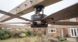 Anti-corrosive stainless steel ceiling fan mounted in a seaside gazebo to prevent rust from sea spray.