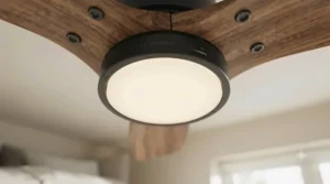 Integrated dimmable LED light kit glowing warmly on a stylish bedroom ceiling fan unit.