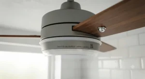 Detail view of the splash-proof protective seal on an IP44 rated ceiling fan fixture.