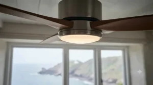 Marine grade ceiling fan with integrated LED lighting installed in a coastal home dining room.