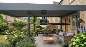 Sleek black modern ceiling fan fitted to a contemporary aluminium pergola on a decking area