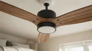 Close-up of natural timber-finish blades on a quiet ceiling fan styled in a neutral-toned master bedroom.