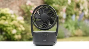 Close-up of a portable battery-powered gazebo fan featuring adjustable speed settings.