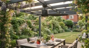Modern black outdoor dining fan mounted on a pergola above a contemporary patio set.