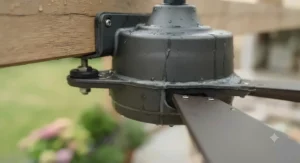 Close-up of a damp-rated outdoor ceiling fan motor housing designed to withstand unpredictable British weather.