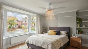 Quiet ceiling fan with heating mode fitted in a cosy UK bedroom, providing gentle warmth and comfortable sleep.