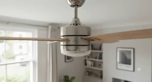 Sleek, energy-saving DC motor housing on a silent reversible ceiling fan fitted in a living area.