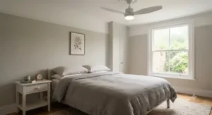 Quiet energy saving ceiling fan with integrated LED light fitted in a stylish UK bedroom.