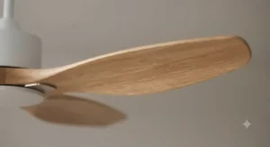 Close-up of sustainably sourced wooden blades on a high-efficiency eco-friendly ceiling fan.