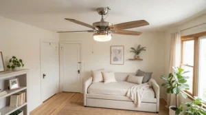 Elegant brushed nickel ceiling fan with light for low ceiling adding comfort to a brightly decorated guest bedroom.