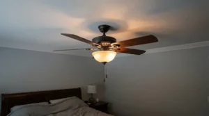 A quiet reversible ceiling fan with light fitted in a cosy bedroom with integrated LED lighting