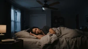 A sleep timer ceiling fan spinning gently in a cosy bedroom during a quiet night.